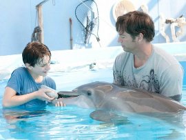 Nathan Gamble and Harry Connick Jr. in Dolphin Tale