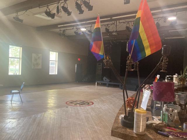 An interior view of Village Theatre, featuring Pride flags.