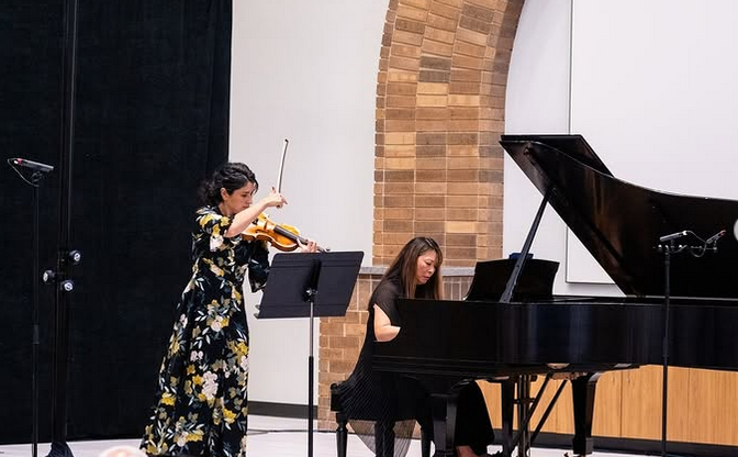 Lee is a frequent collaborator with QCSO concertmaster Naha Greenholtz on violin, seen here at the Rock Island Public Library's Watts-Midtown branch auditorium.